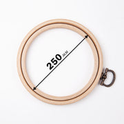 Embroidery hoop with metal hanging loop.