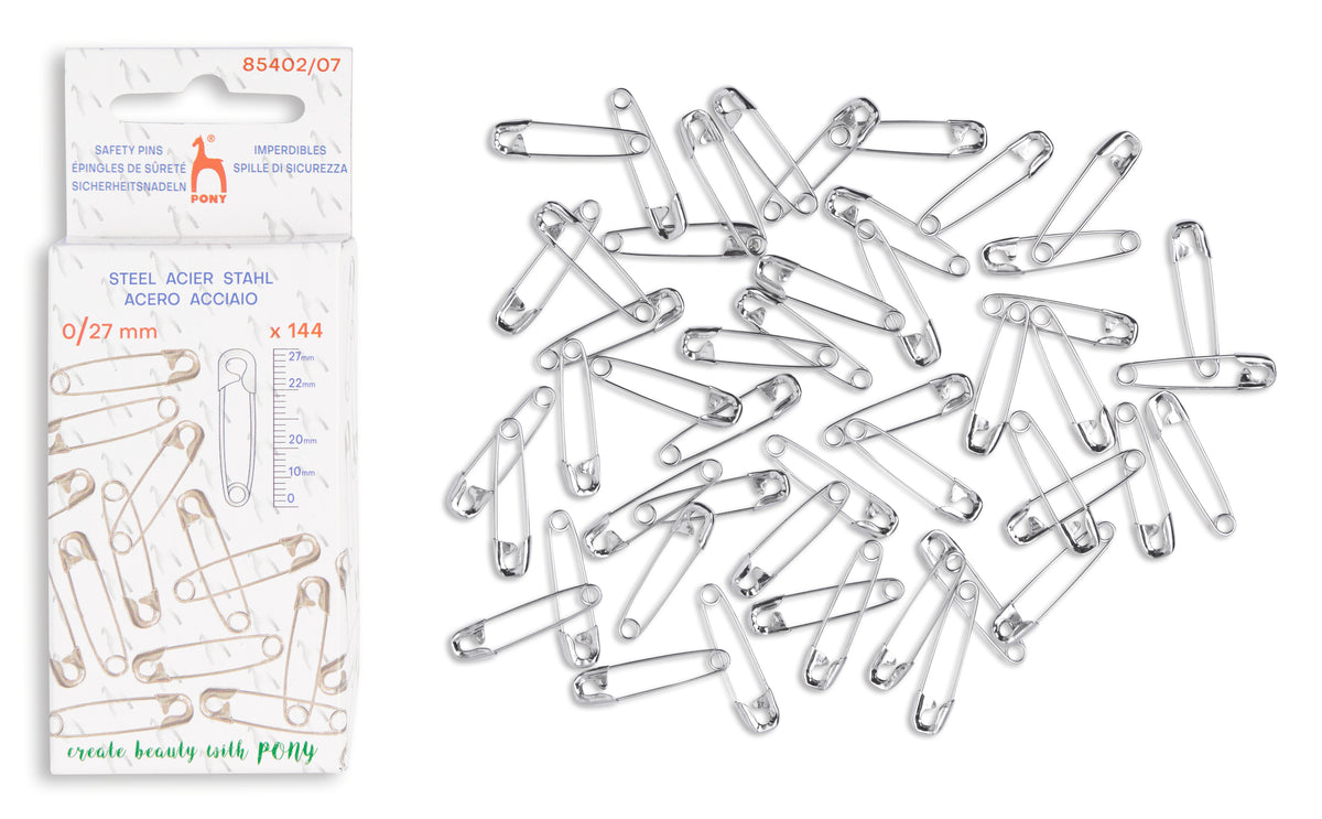 A pack of 144 steel safety pins in size 0/21 mm, shown next to a pile of the same silver-colored metal safety pins on a plain white background.